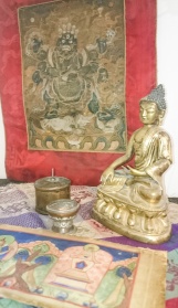 statue and small thangka